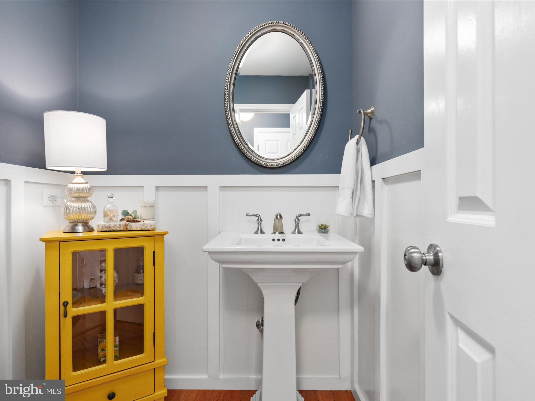 20299 Mustoe Place Ashburn, VA 20147 - Photo 17 of 45 a bathroom with a sink and a mirror