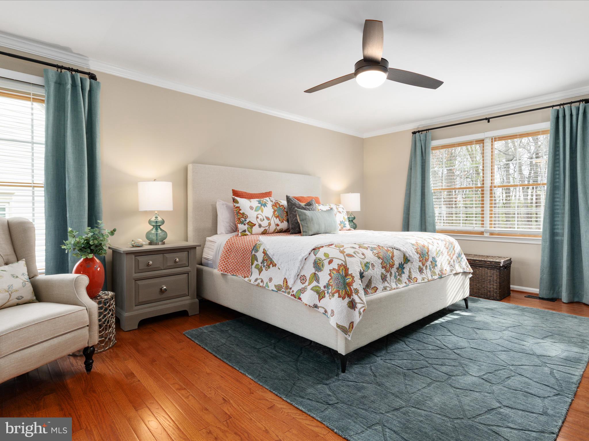 20299 Mustoe Place Ashburn, VA 20147 - Photo 18 of 45 a bedroom with a bed and a chandelier