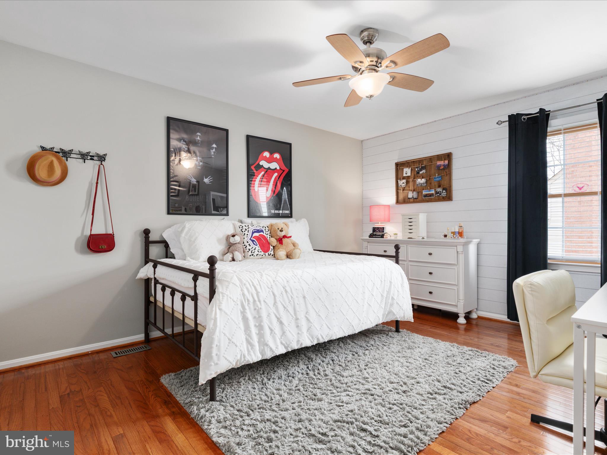 20299 Mustoe Place Ashburn, VA 20147 - Photo 23 of 45 a bedroom with a bed and wooden floor