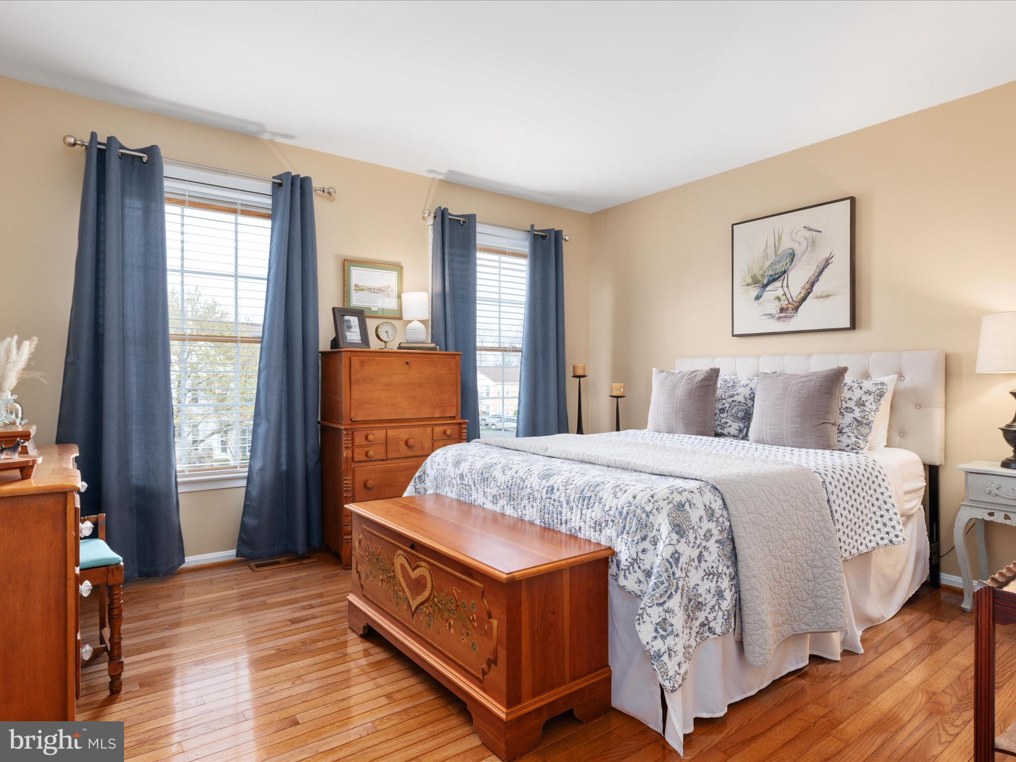 20299 Mustoe Place Ashburn, VA 20147 - Photo 25 of 45 a bed sitting in a bedroom next to a window