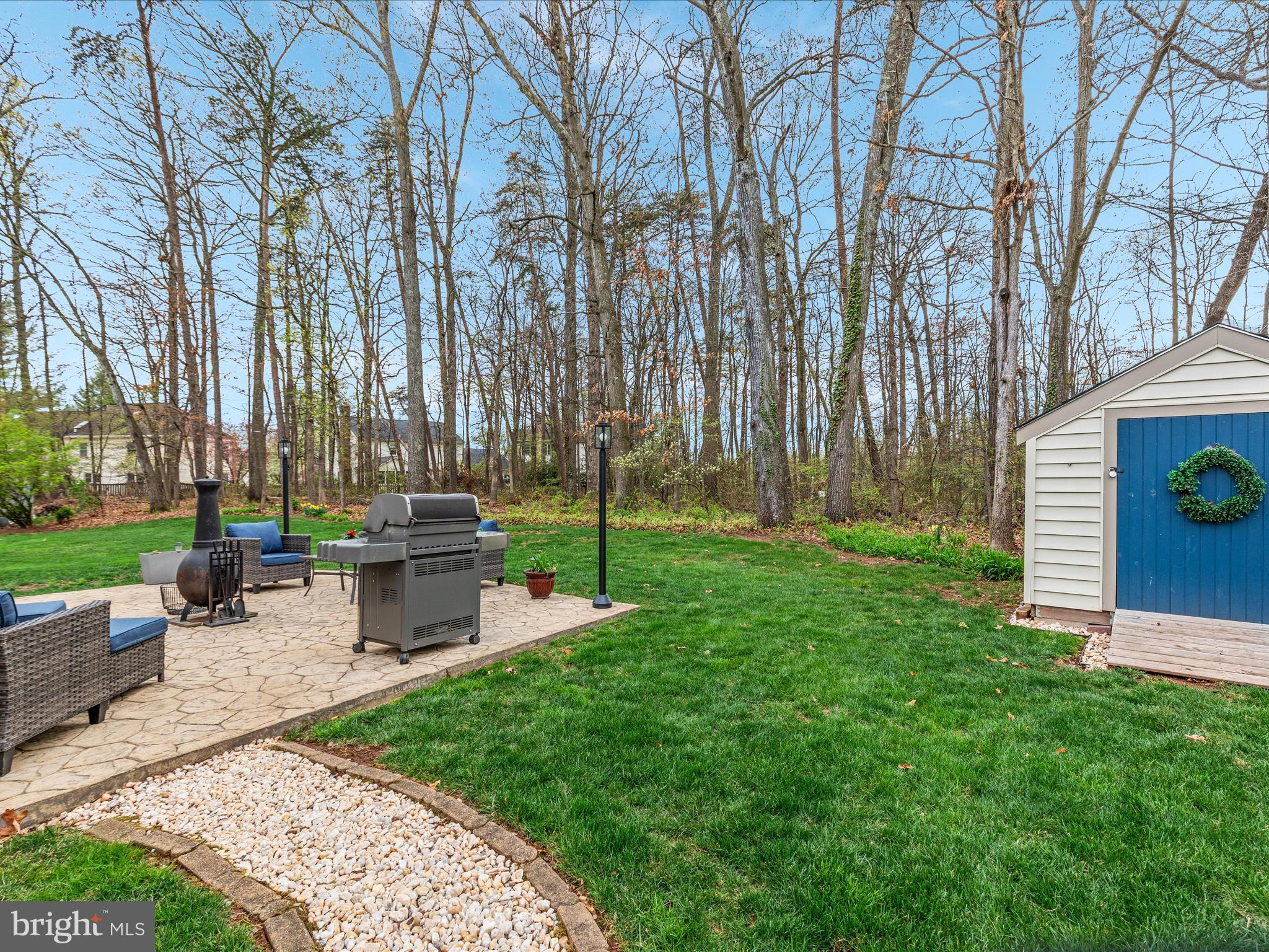 20299 Mustoe Place Ashburn, VA 20147 - Photo 37 of 45 a garden view with a sitting space