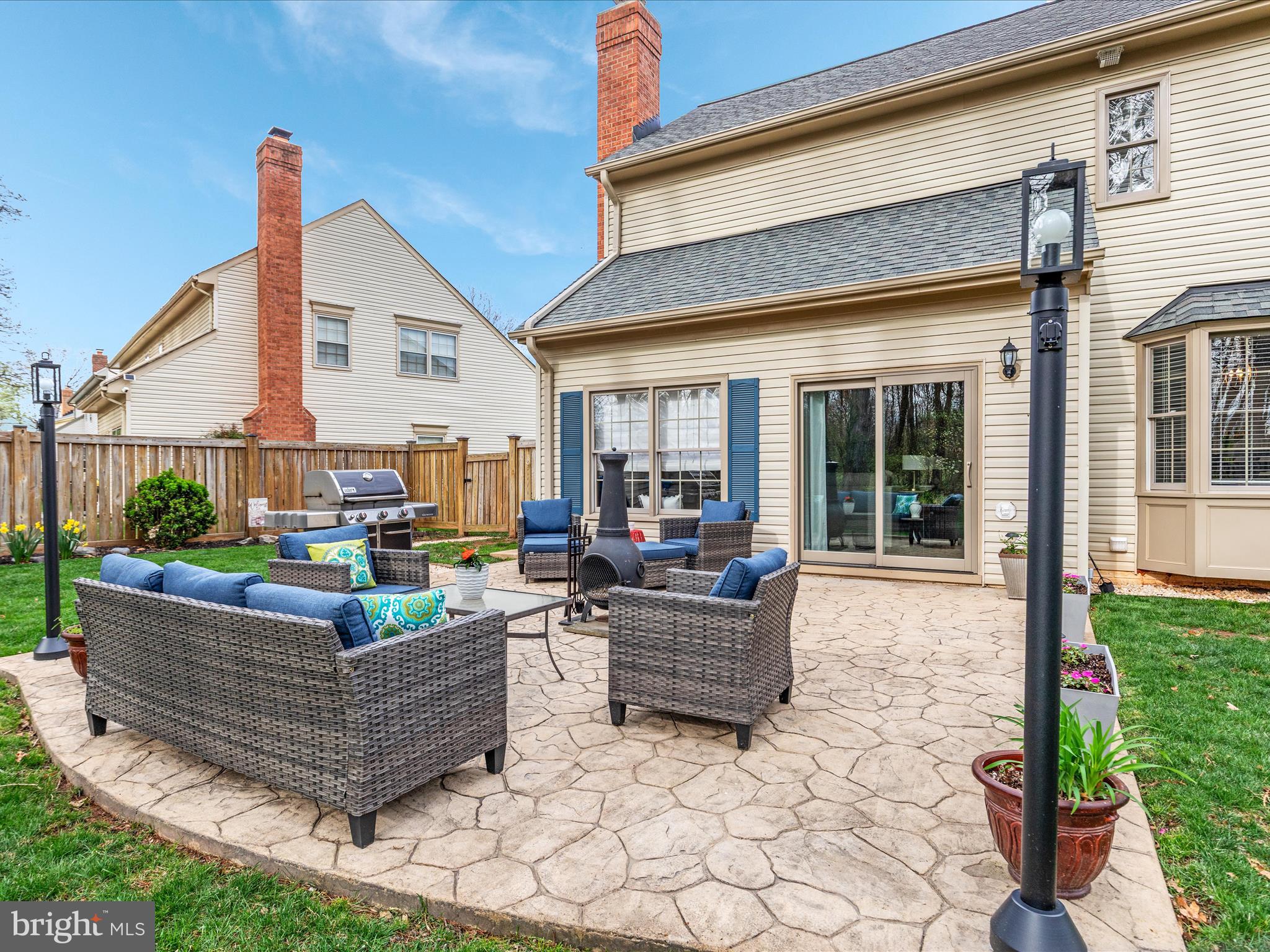20299 Mustoe Place Ashburn, VA 20147 - Photo 38 of 45 a living room with couch a table and chairs