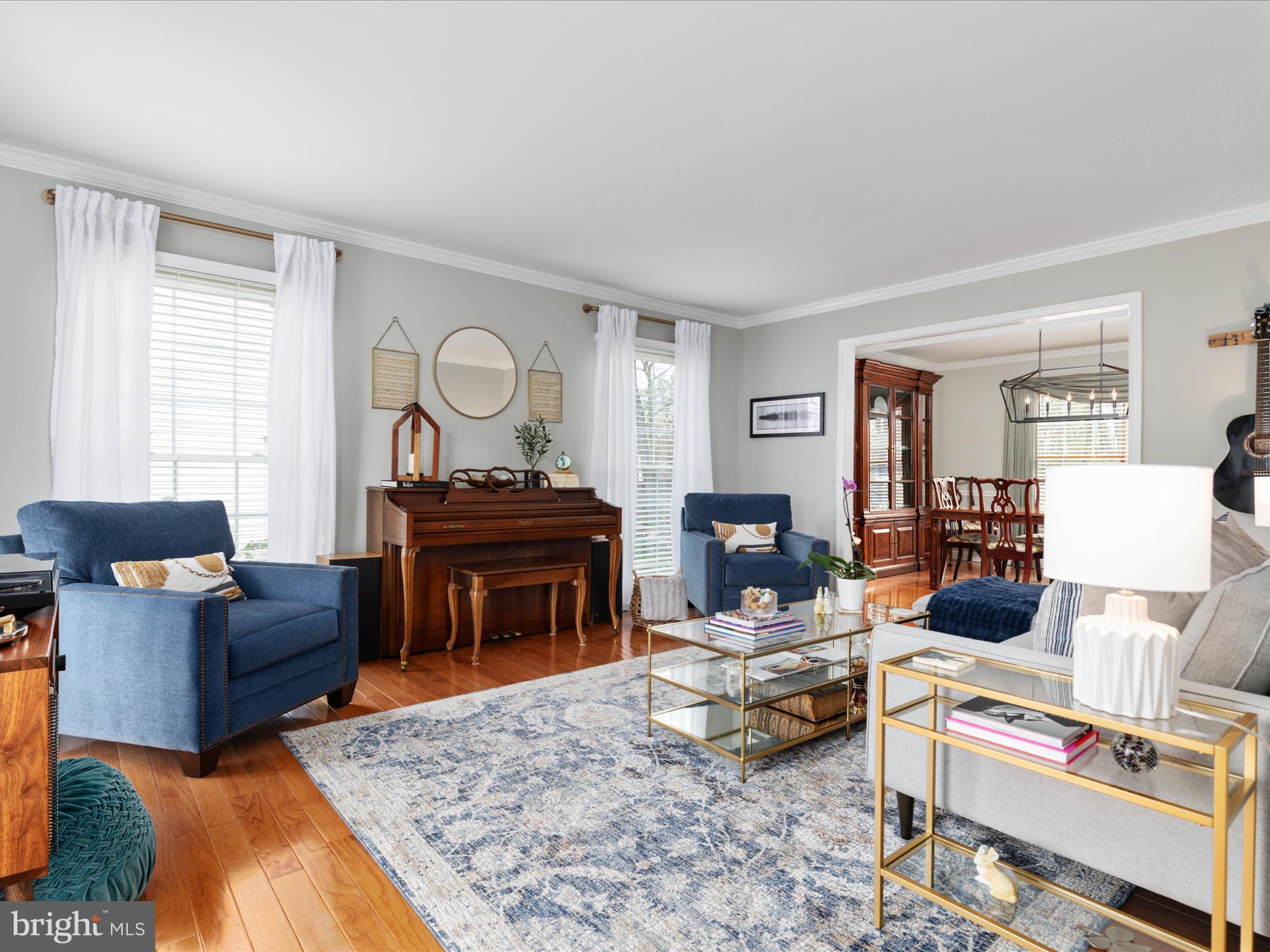 20299 Mustoe Place Ashburn, VA 20147 - Photo 7 of 45 a living room with furniture and a piano