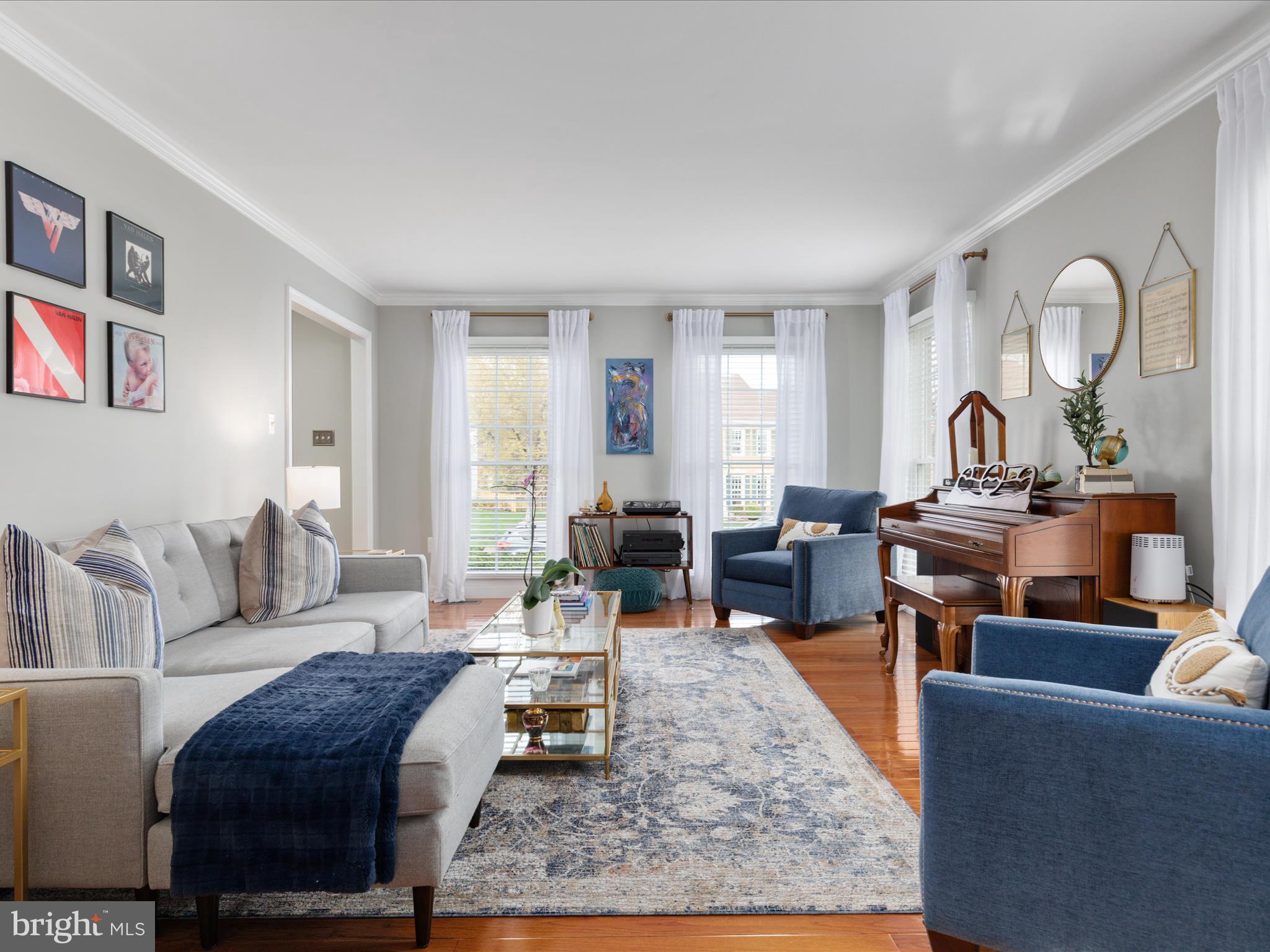 20299 Mustoe Place Ashburn, VA 20147 - Photo 8 of 45 a living room with furniture a couch and wooden floor