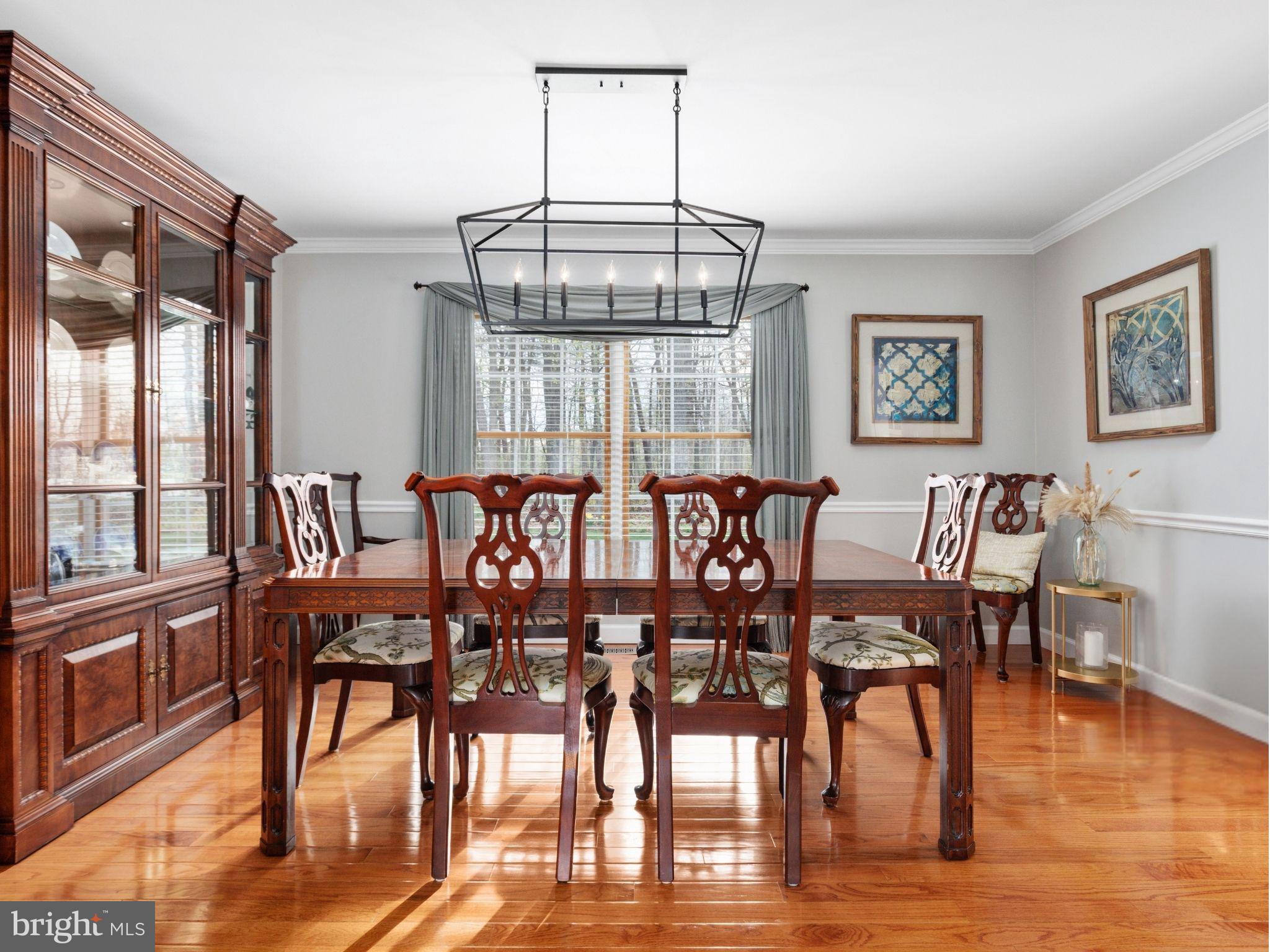 20299 Mustoe Place Ashburn, VA 20147 - Photo 9 of 45 a view of a dining room with furniture window and wooden floor