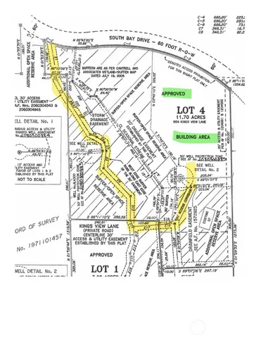 a view of a grassy field with an trees