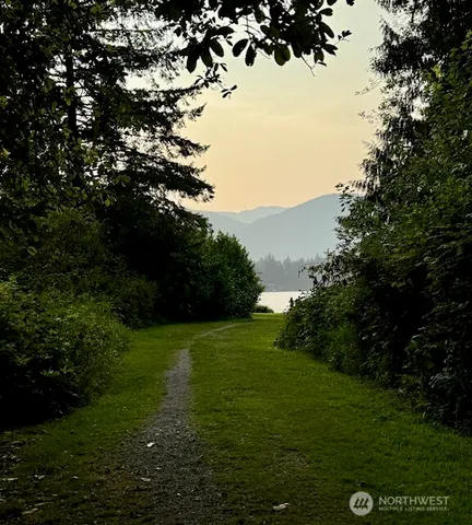 a view of a lake with houses in the back