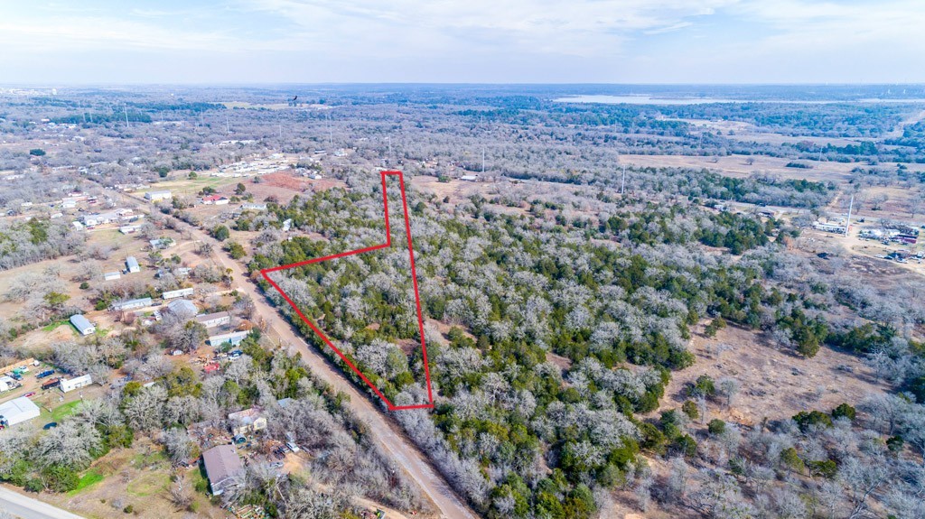 0 B J B J Mayes Road Bastrop, TX 78602 - Photo 4 of 32 an aerial view of house with yard and mountain in the background