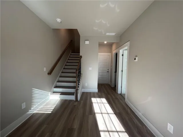 a view of entryway with wooden floor