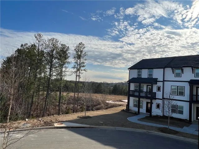 a backyard of a house with lots of green space
