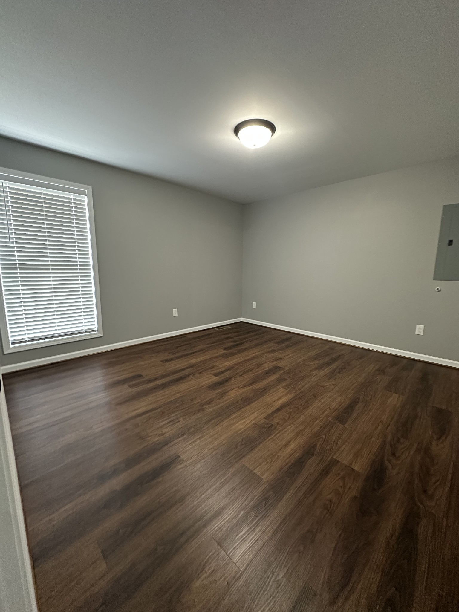 163 Rigling Road Loretto, TN 38469 - Photo 20 of 22 an empty room with wooden floor and windows