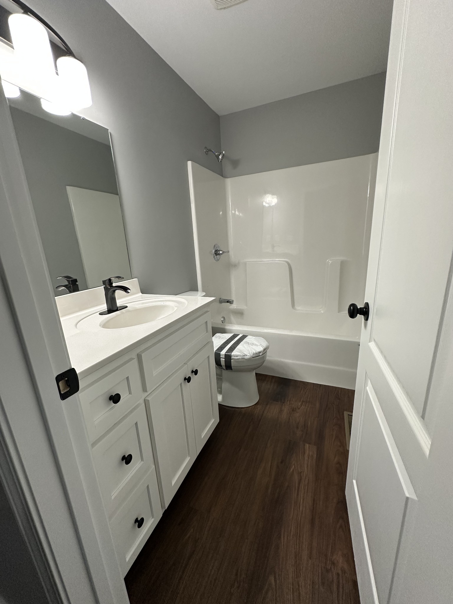 163 Rigling Road Loretto, TN 38469 - Photo 22 of 22 a bathroom with a double vanity sink toilet and tub