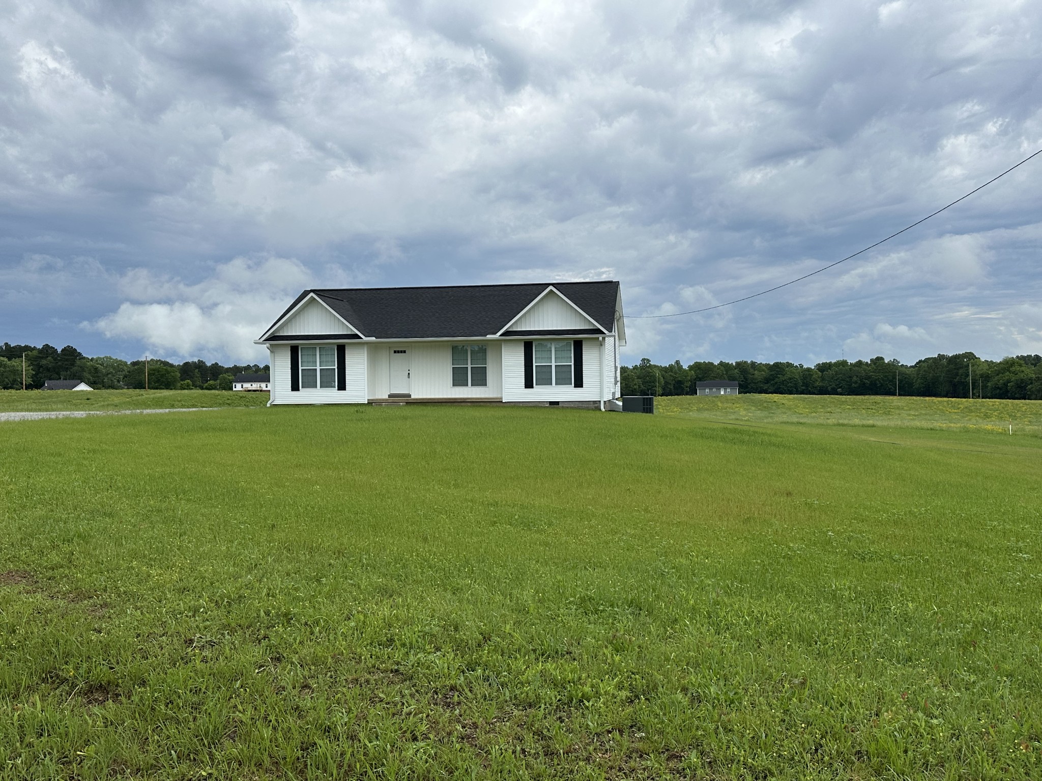 163 Rigling Road Loretto, TN 38469 - Photo 6 of 22 a house view with a garden space