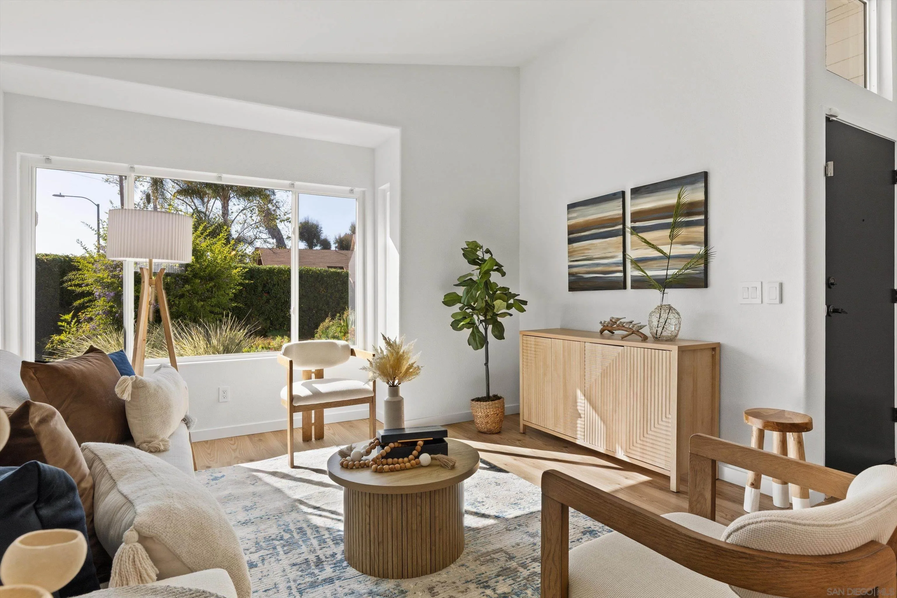 4640 Waverly Road Oceanside, CA 92056 - Photo 11 of 49 a living room with furniture and a potted plant