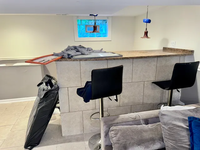 a kitchen with a table and chairs in it