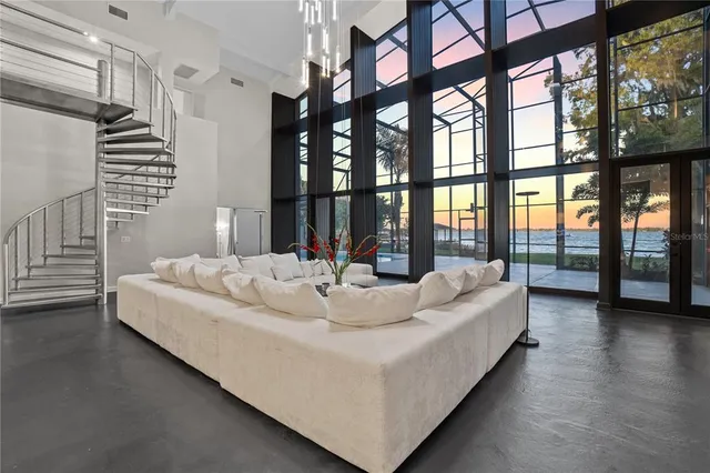 a living room with couches and a flat screen tv