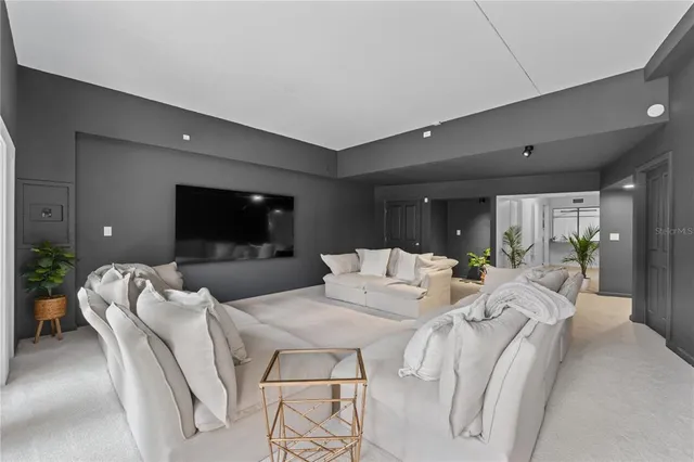 a spacious bedroom with a bed and a window