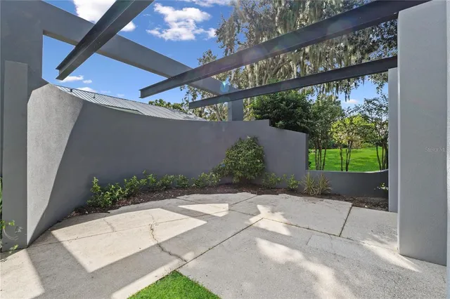 a living room with a bed furniture and a window