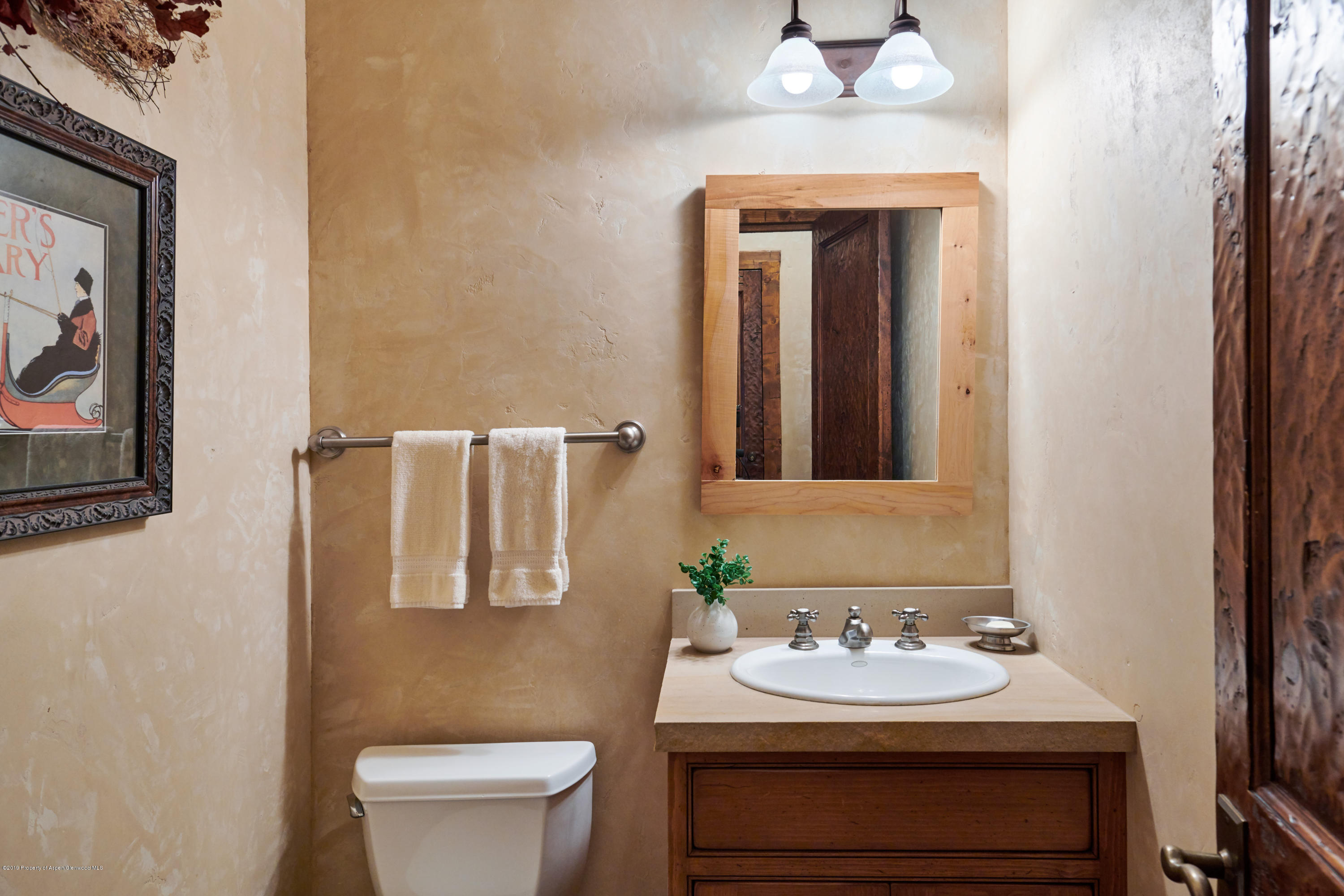 38 Altamira Ranch Road Basalt, CO 81621 - Photo 9 of 16 a bathroom with a sink vanity mirror and toilet