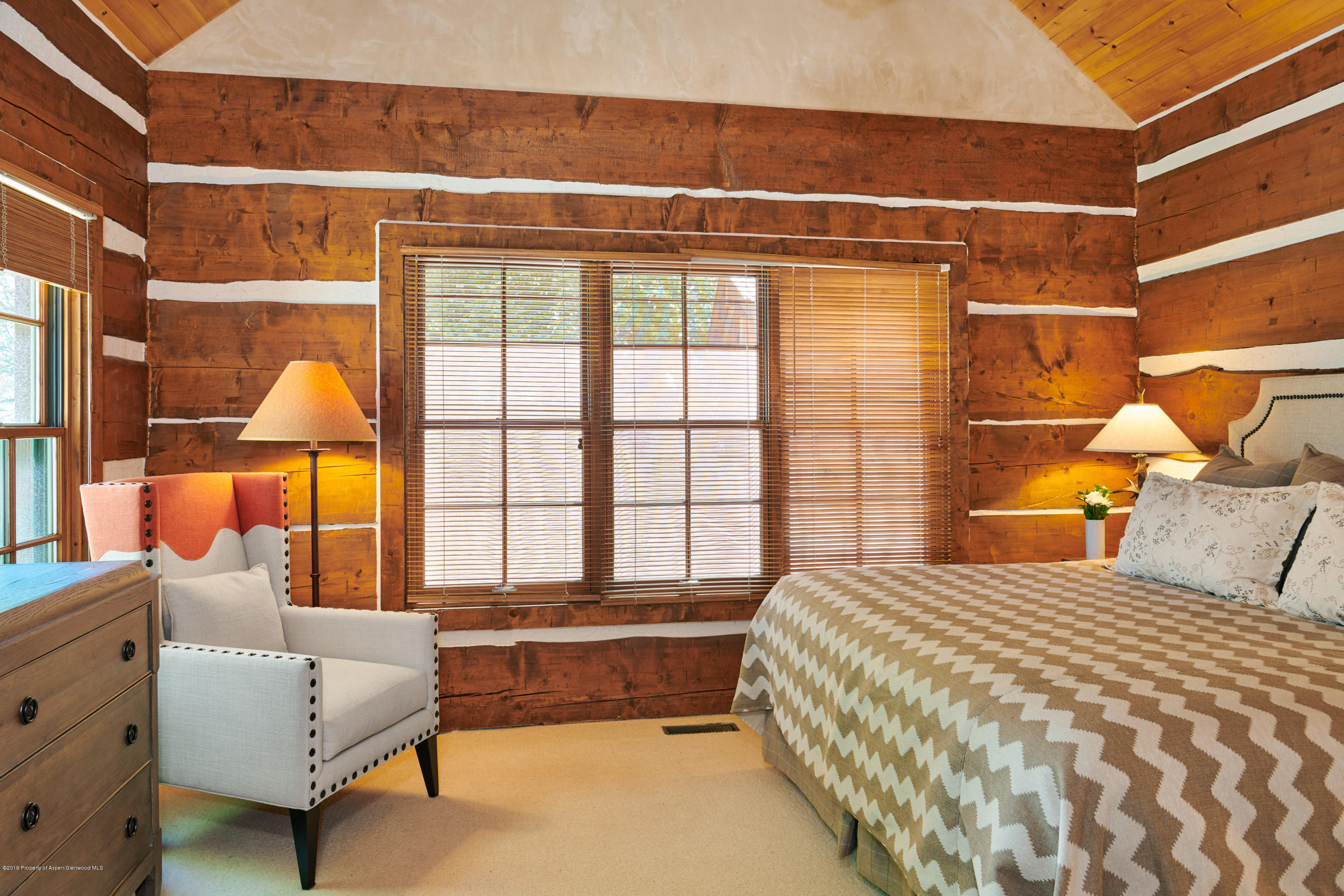 38 Altamira Ranch Road Basalt, CO 81621 - Photo 10 of 16 a bedroom with a bed and a large window