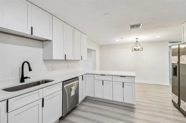 a bathroom with a sink toilet and mirror