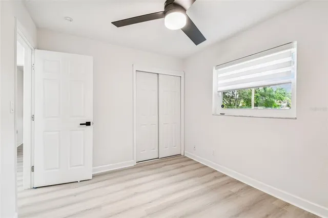 a view of an empty room and wooden floor