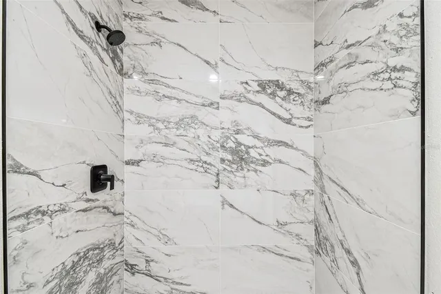 a view of kitchen with refrigerator microwave and stove