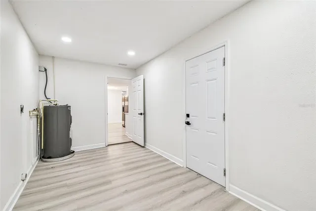 a view of a livingroom with wooden floor and a window