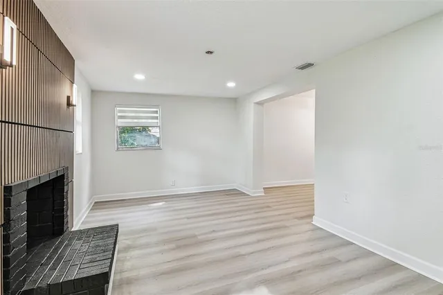 a view of empty room with ceiling fan