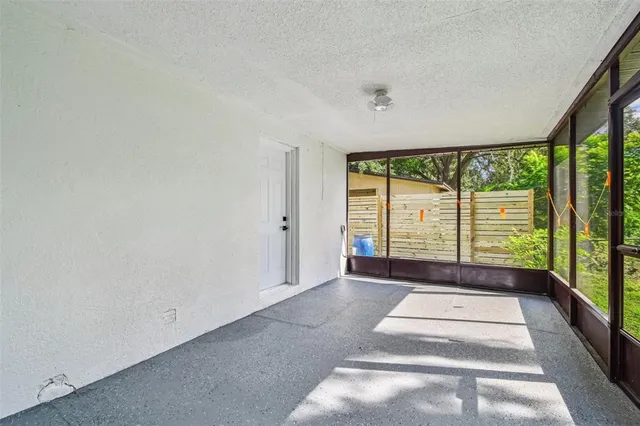 a front view of a house with a garden and yard