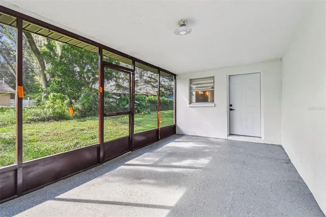 a front view of a house with swimming pool yard and patio