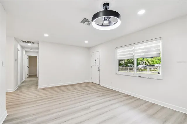 a house with swimming pool in front of it