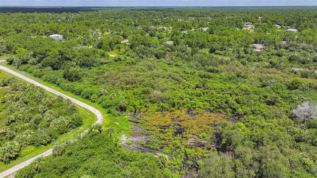 a view of a garden with a building