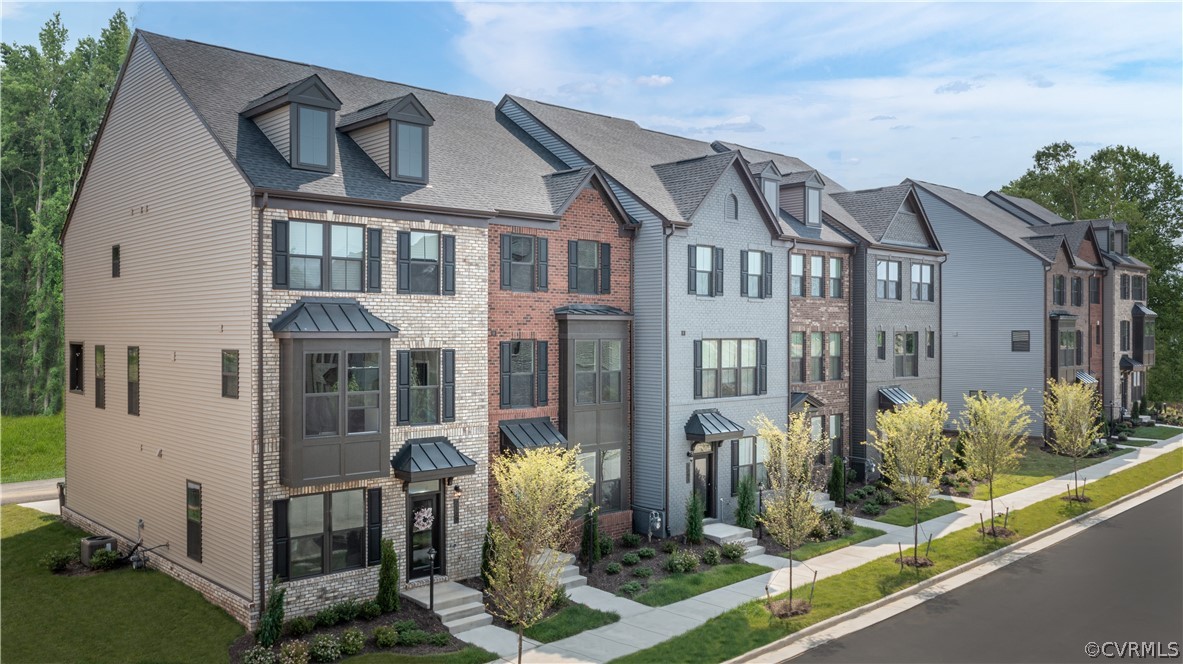 14112 Millpointe Road, Unit 4C Midlothian, VA 23114 - Photo 1 of 18 a front view of a house with a garden