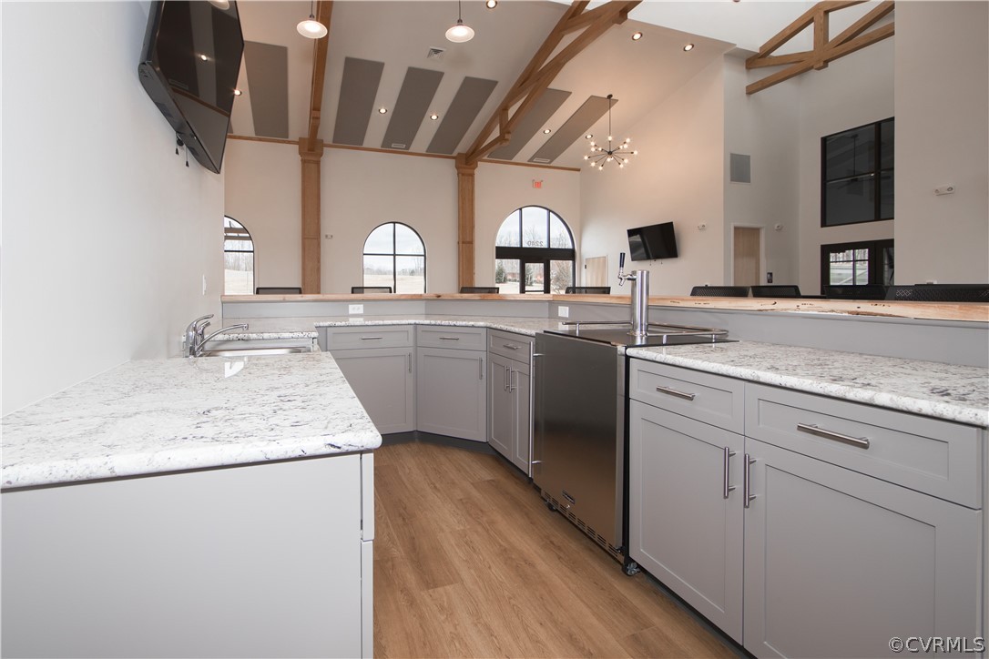 14112 Millpointe Road, Unit 4C Midlothian, VA 23114 - Photo 14 of 18 a kitchen with a sink cabinets and wooden floor