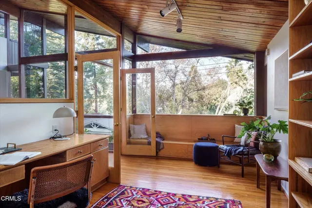 a workspace with furniture and a window