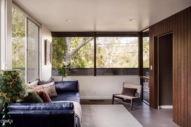 a bedroom with furniture and a fireplace