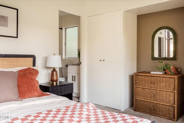 a living room with furniture and floor to ceiling window