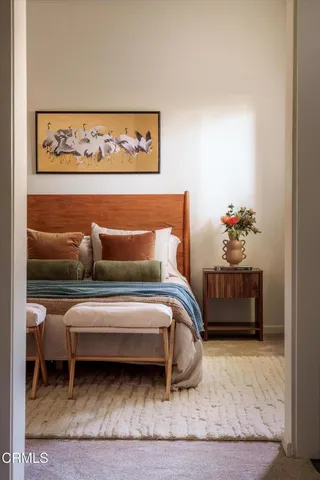 a view of a patio with couches chairs and a potted plant