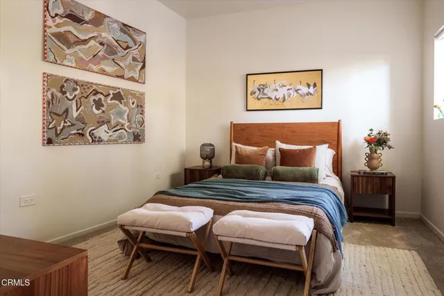 a balcony with furniture and a potted plant