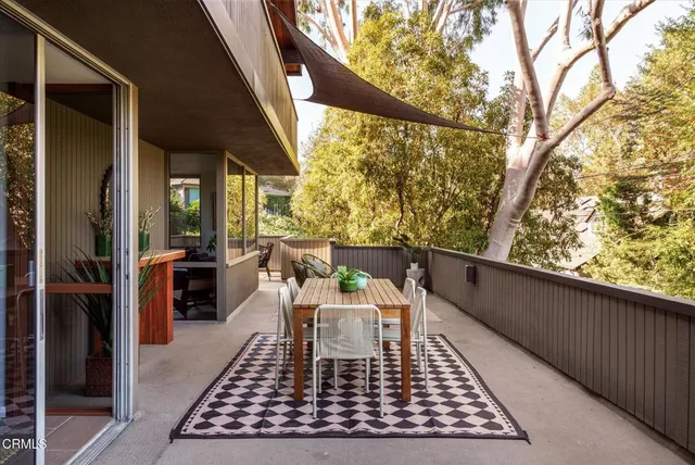 a view of a wooden deck with furniture