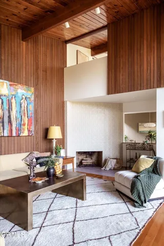 a view of a porch with chairs and backyard