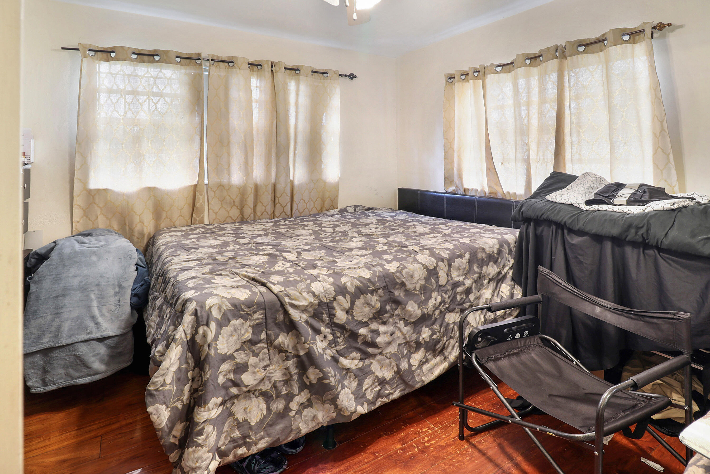 4710 Northwest 11th Place Lauderhill, FL 33313 - Photo 11 of 12 a bed sitting in a room next to a window