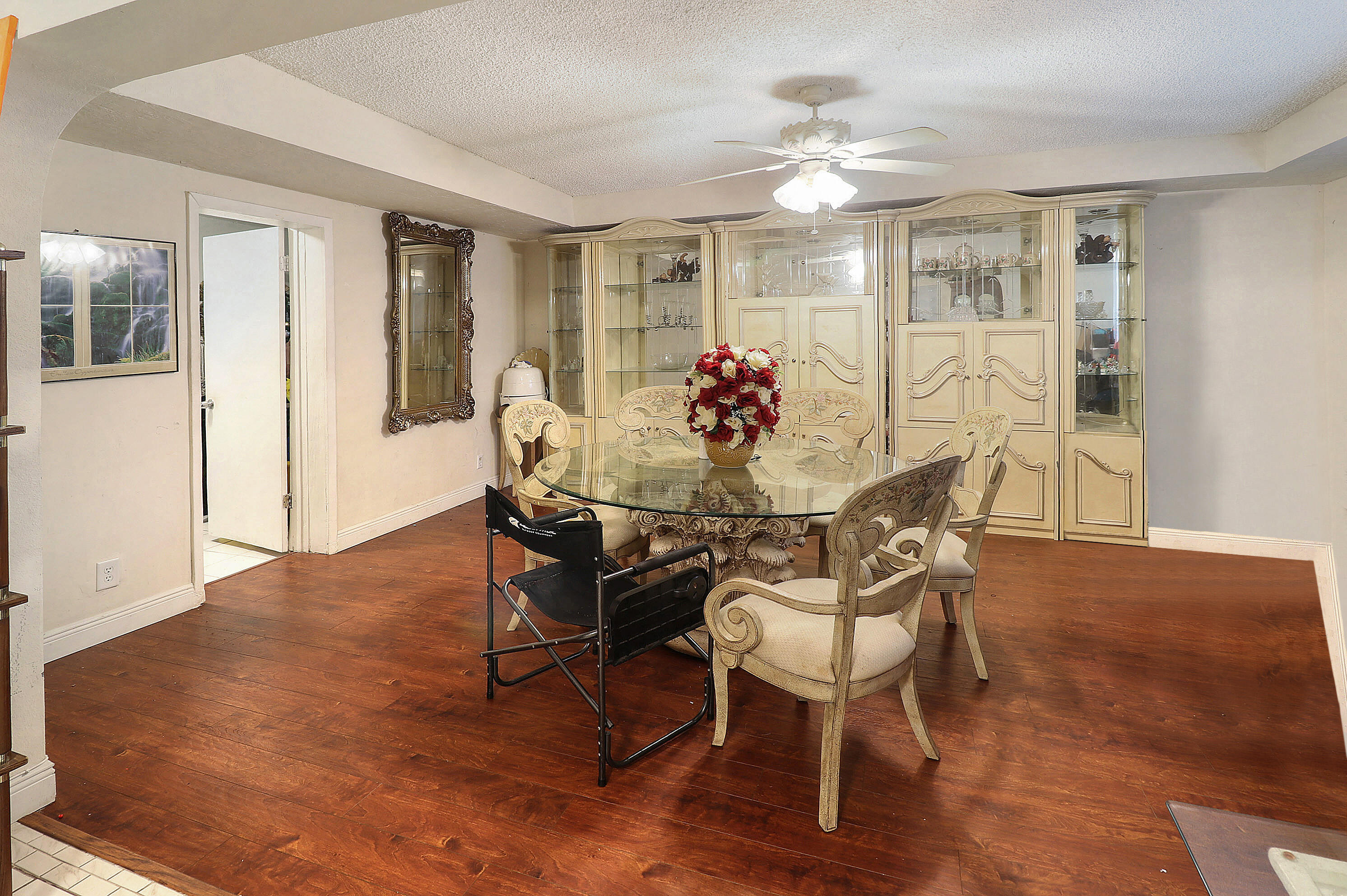 4710 Northwest 11th Place Lauderhill, FL 33313 - Photo 3 of 12 a view of a dining room with furniture and wooden floor