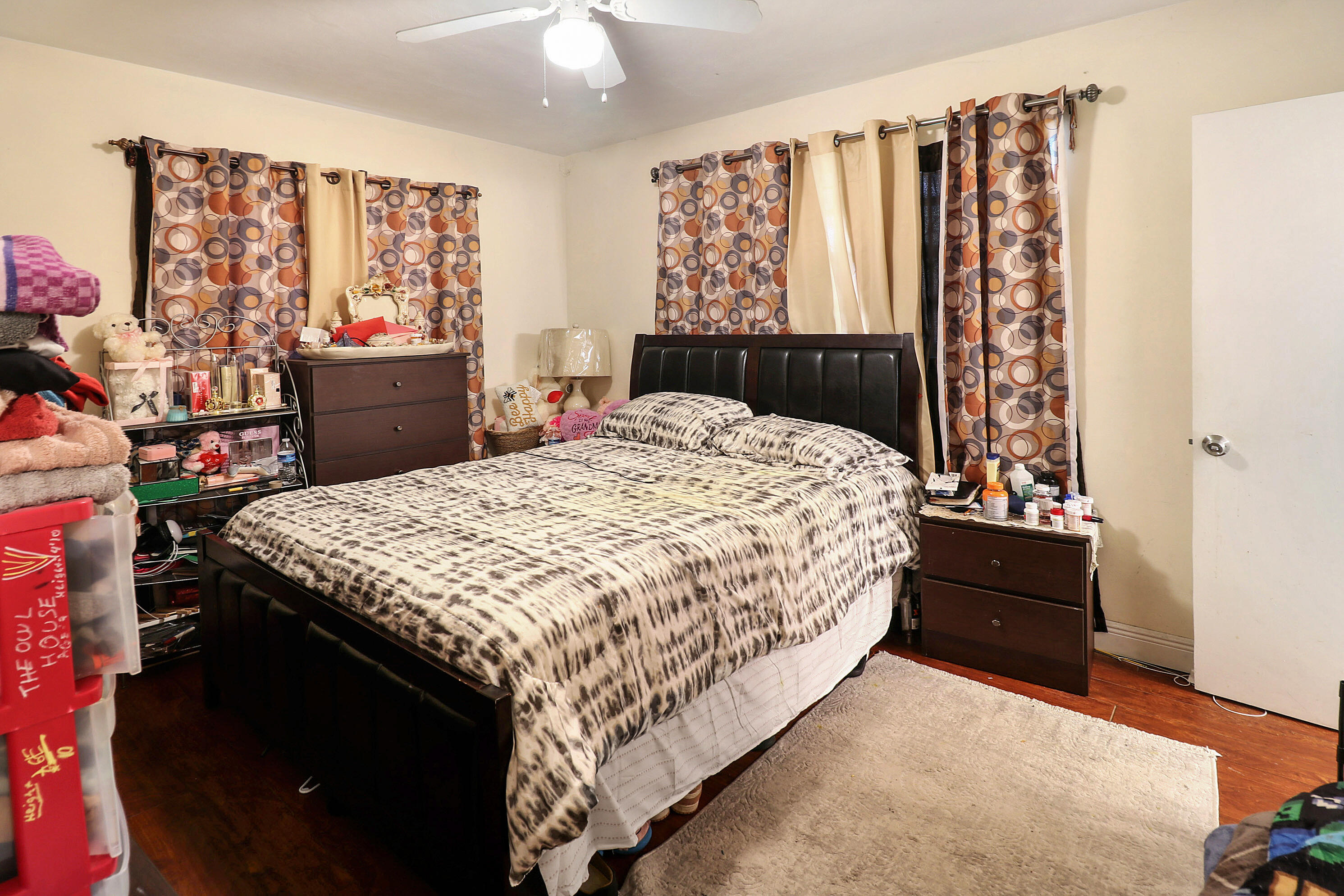 4710 Northwest 11th Place Lauderhill, FL 33313 - Photo 7 of 12 a bedroom with a bed and a window