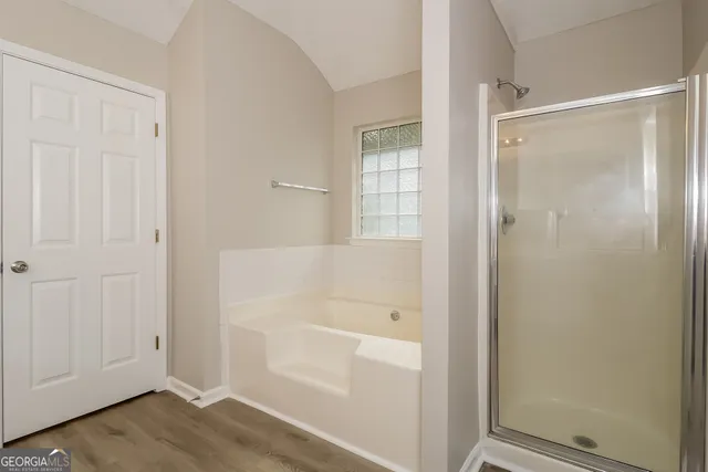a bathroom with a glass shower door