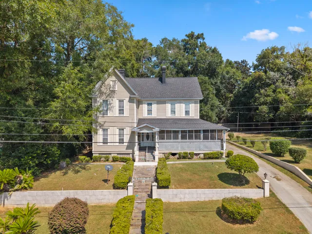 a view of a house with swimming pool