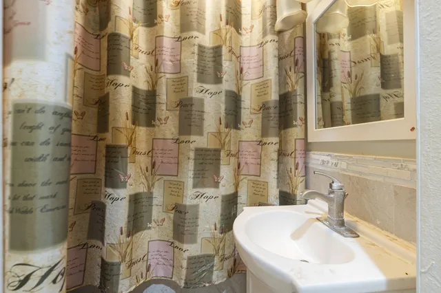 a view of a hallway with seating area