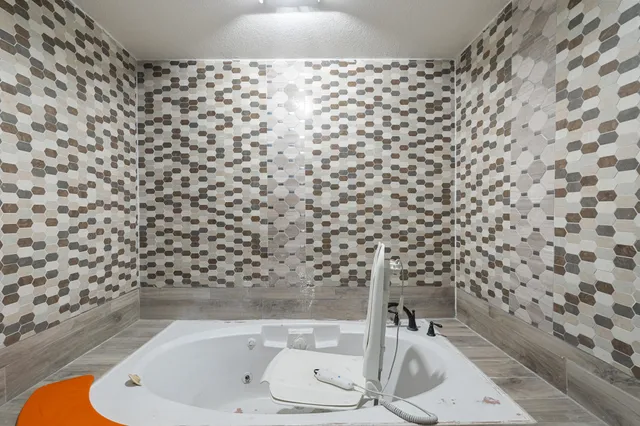 a bathroom with a shower and a sink