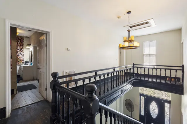 a bathroom with a sink toilet and shower curtain